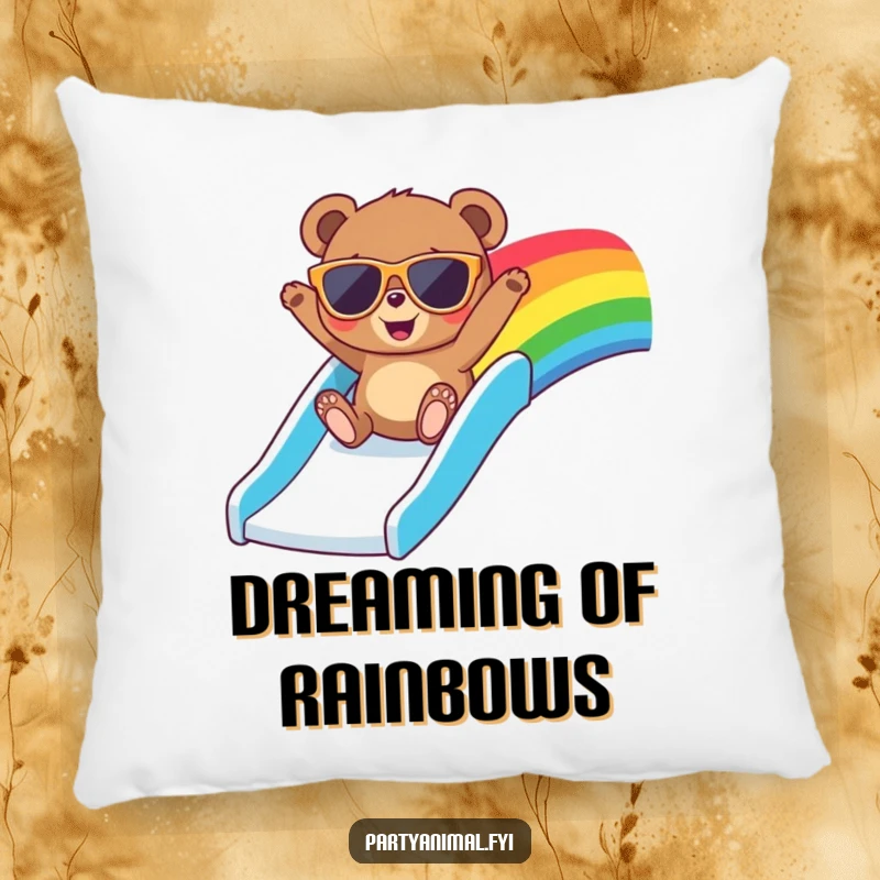 Funny pillow featuring a bear in large sunglasses, gleefully sliding down a vibrant rainbow, ready to bring comfort and smiles.