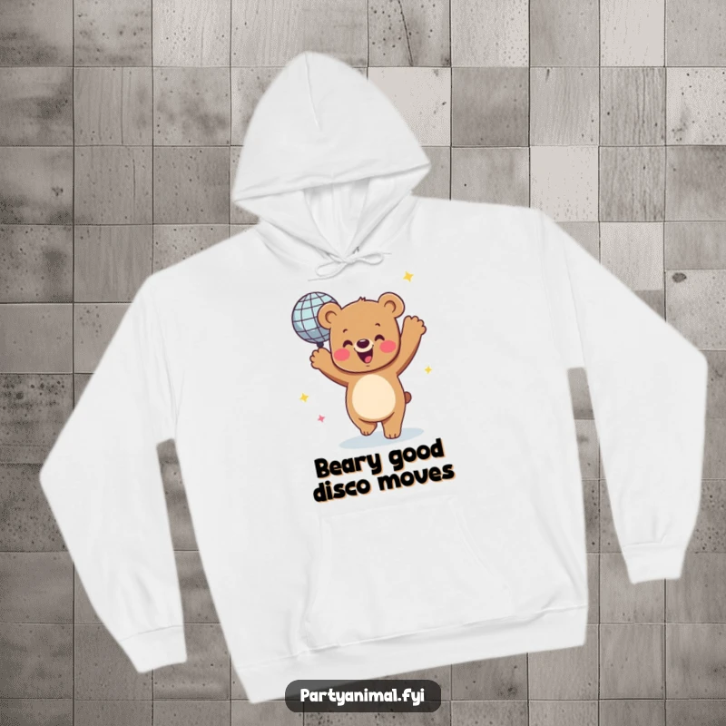 Funny hoodie featuring a jubilant bear character dancing with a dazzling, spinning disco ball, embodying a festive dance party atmosphere.