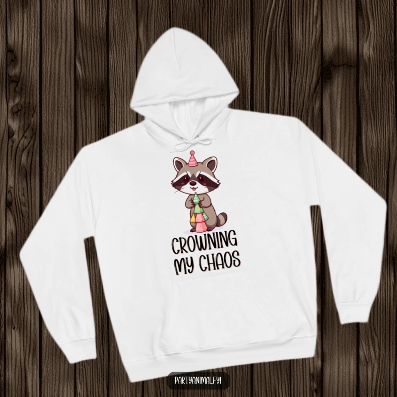 Funny Hoodie depicting a mischievous raccoon balancing a stack of tiny party hats, offering warmth and a fun, festive design for casual wear.