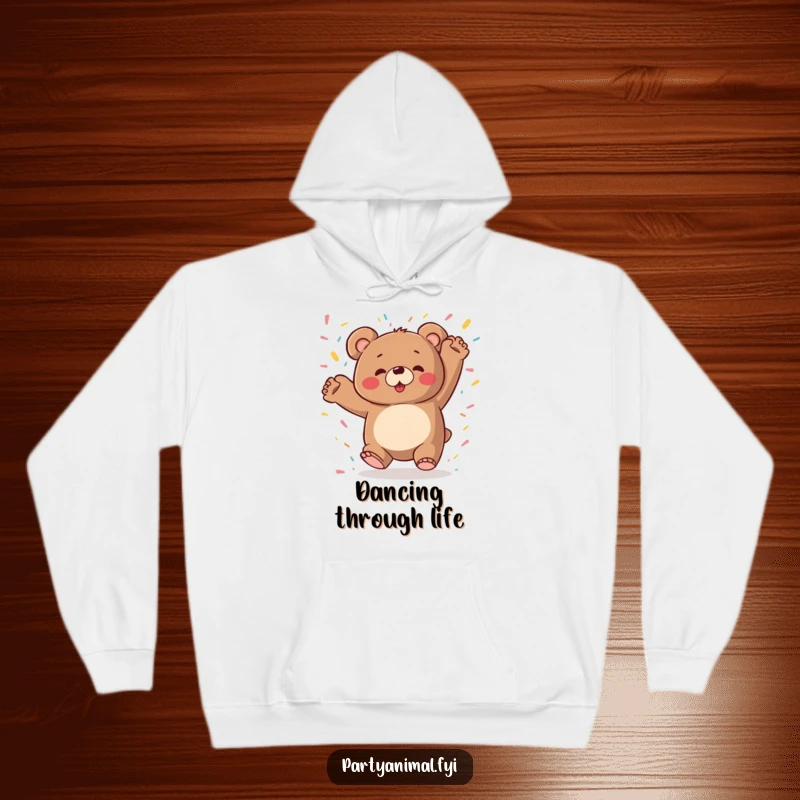 Chubby bear character dancing wildly with colorful confetti raining down, printed on a cozy and funny hoodie.