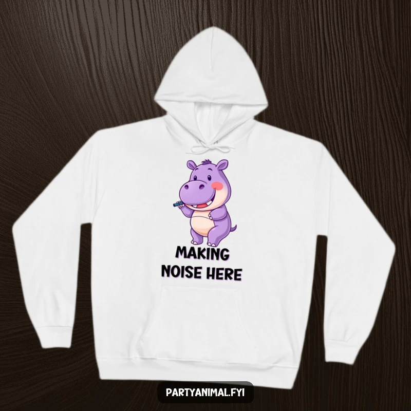 Funny Hoodie showcasing a purple hippo character happily twirling a noisemaker with a wide smile, perfect for festive comfort.