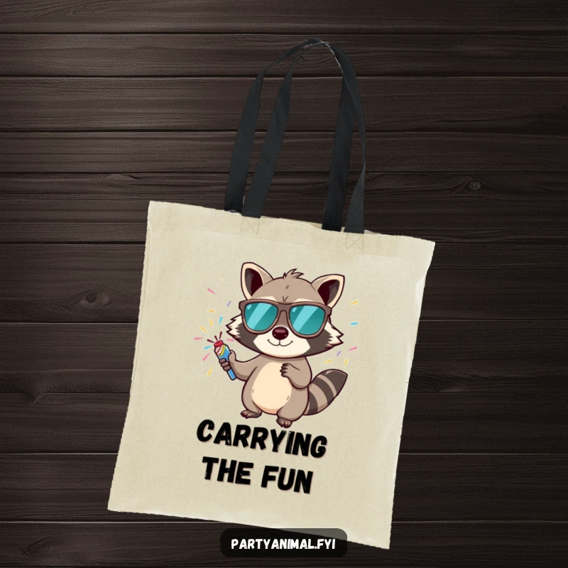 Funny tote bag with a mischievous raccoon in sunglasses holding a confetti popper, perfect for carrying party supplies.